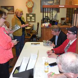 Noted local author/historian team Neary and Dunkelberger signing copies of their latest book.