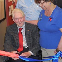 LTG (ret) Bill Harrison, first mayor of Lakewood, prepares to snip the ribbon.