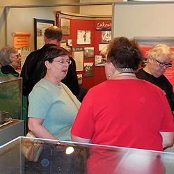 Meg Justus, museum consultant for our exhibits over the past several years, stands amidst her latest creation.