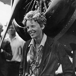 The real deal: Amelia and her plane in the early nineteen-thirties.